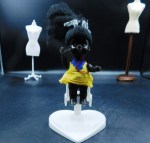 small black hp doll yellow
